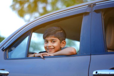 Cute Indian child in car