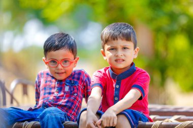 Cute Indian little boy playing in the outdoor