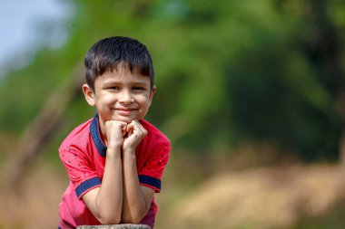 Cute Indian little boy playing in the outdoor