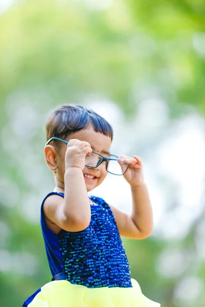 Indian little  girl on spectacles