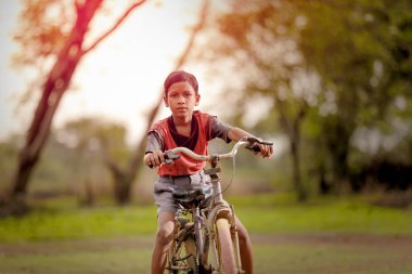 indian child on bicycle