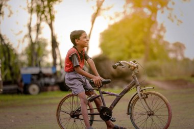 indian child on bicycle