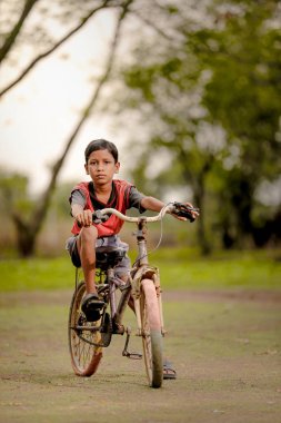 indian child on bicycle