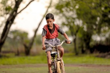 indian child on bicycle