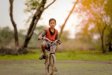 indian child on bicycle