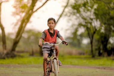 indian child on bicycle