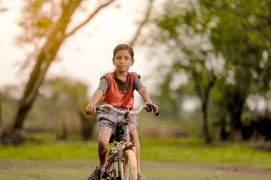 indian child on bicycle