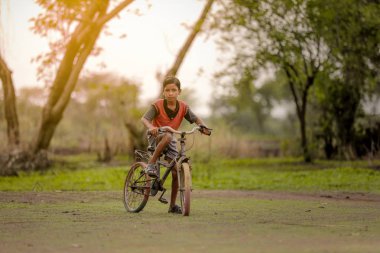 indian child on bicycle