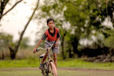 indian child on bicycle