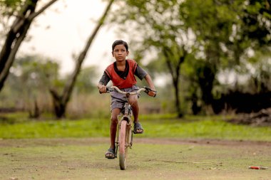 indian child on bicycle