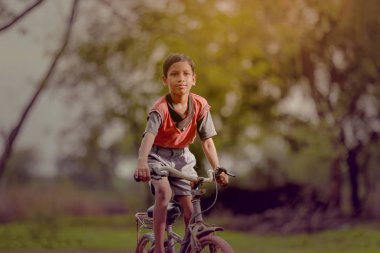 indian child on bicycle