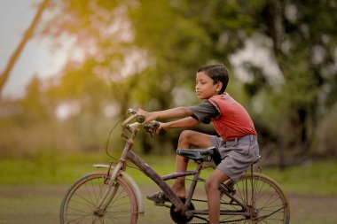 indian child on bicycle