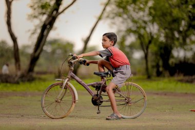 indian child on bicycle