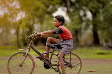 indian child on bicycle