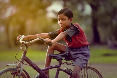 indian child on bicycle
