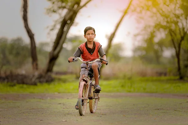 indian child on bicycle