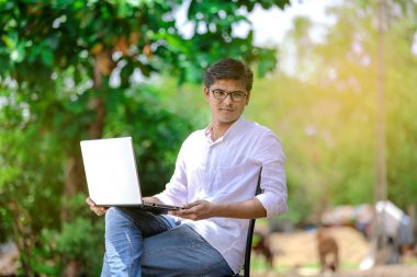 young Indian man using laptop , Working on Laptop