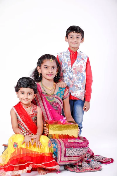 cute Indian brother and sister celebrating raksha bandhan festival ,