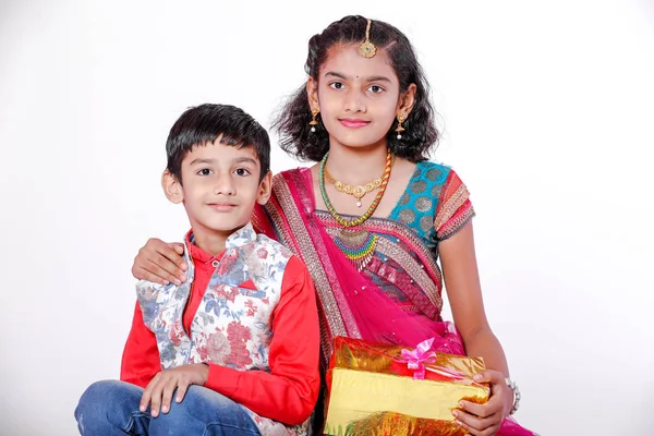 cute Indian brother and sister celebrating raksha bandhan festival ,