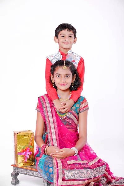 cute Indian brother and sister celebrating raksha bandhan festival ,