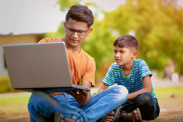 Two Indian Brothers Working Laptop ストック画像