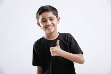little Indian / Asian boy showing thumbs up clipart