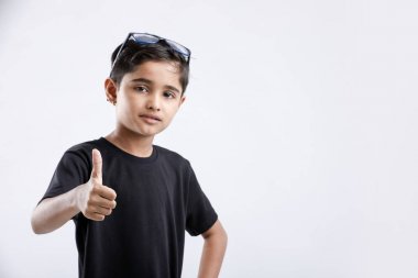 little Indian / Asian boy showing thumbs up