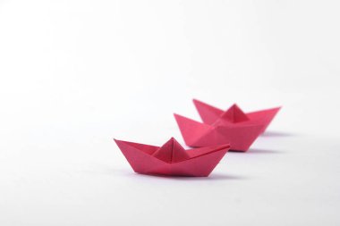 Paper boats over white  background