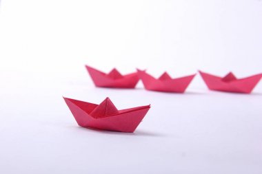 Paper boats over white  background