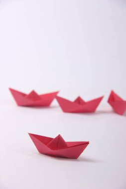 Paper boats over white  background
