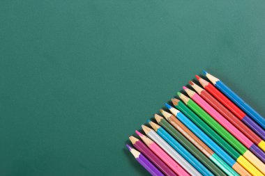 colorful pencil on writing board