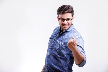 Young indian man showing wining confidence