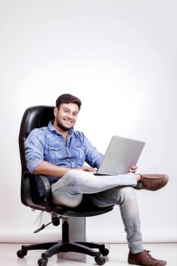  Young indian man with laptop