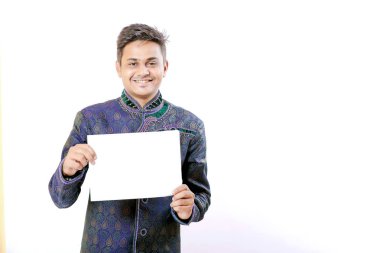 young indian man holding blank poster in hand
