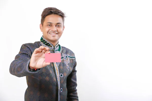 Indian man in ethnic wear and showing card