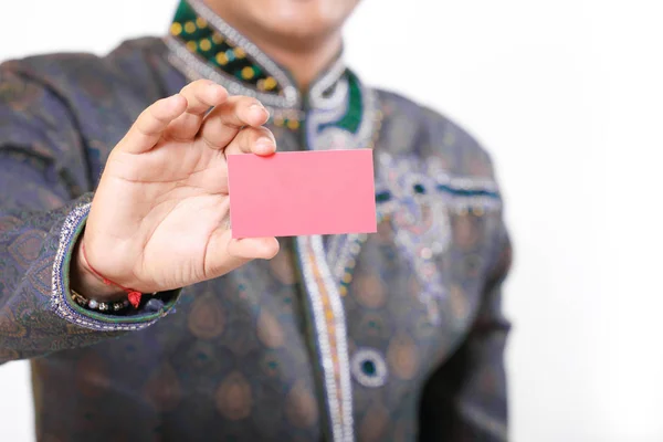 Indian man in ethnic wear and showing card