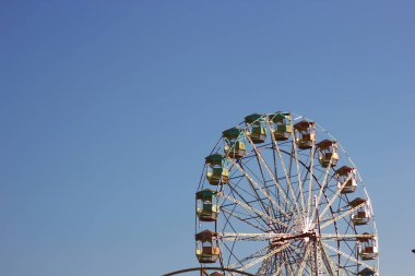ferris wheel on the blue background.