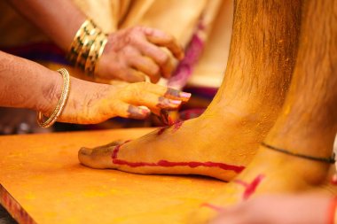 Indian wedding haldi ceremony , groom foot
