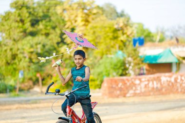 indian child playing with kite