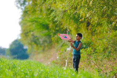Indian child playing with kite