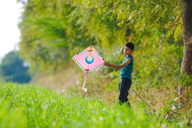 Indian child playing with kite