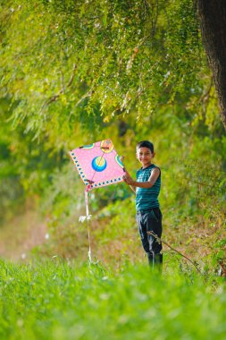 Indian child playing with kite