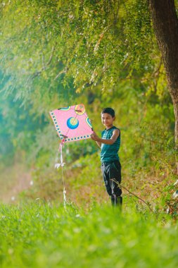Indian child playing with kite