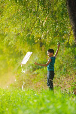 Indian child playing with kite
