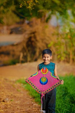 Indian child playing with kite