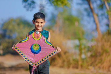 Indian child playing with kite