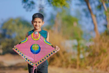 Indian child playing with kite