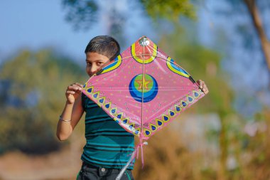 Indian child playing with kite