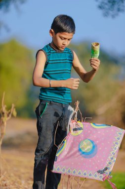 Indian child playing with kite