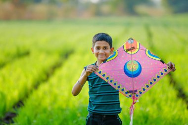 Indian child playing with kite